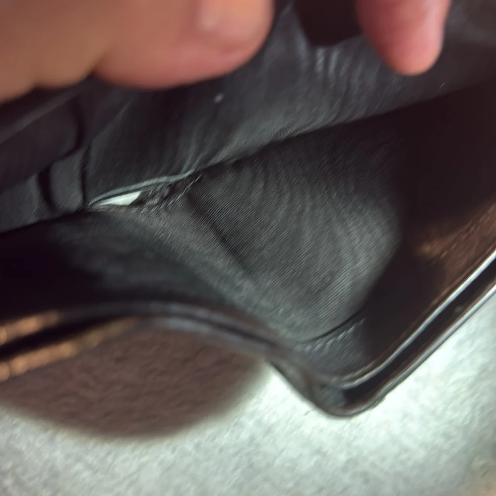 Salvador Ferragamo black bifold wallet.